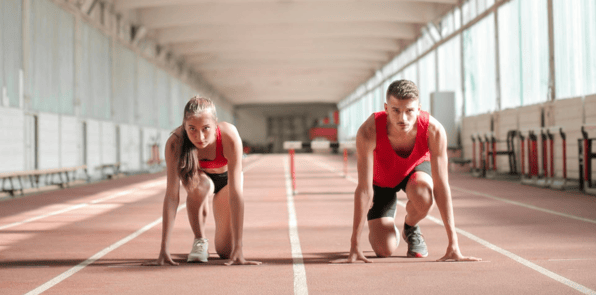 Image of two athletes ready to compete at the starting line