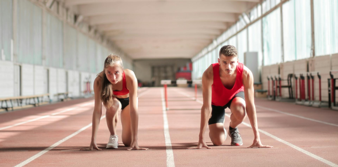 Image of two athletes ready to compete at the starting line